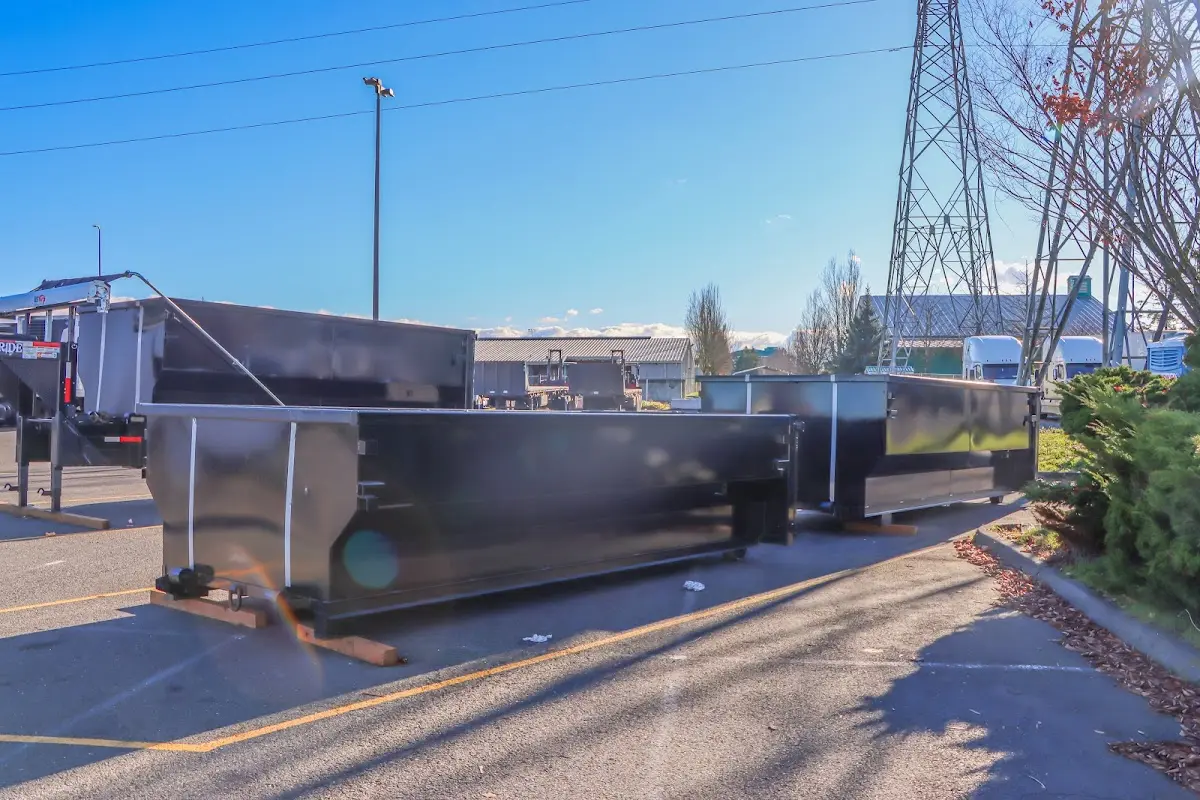 Roll-off dumpster ready for waste disposal at job site for Concrete Dumpster Rental in Four Square Mile